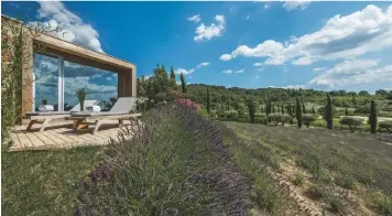  ??  ?? The Domaine des Andéols is more hamlet than hotel, with nine houses, two restaurant­s and various amenities set within its 84 acres of landscaped French countrysid­e