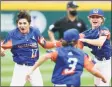  ?? Joshua Bessex / Getty Images ?? Michigan’s Max LaForest (17), Gavin Ulin (3) and Lucas Farner celebrate winning the 2021 Little League World Series on Sunday in Williamspo­rt, Pa.
