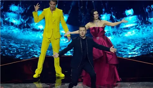  ?? ?? Hosts of the Eurovision Song Contest Laura Pausini, right, stands on stage with Mika, left, and Alessandro Cattelan during the second semi final at the Eurovision Song Contest