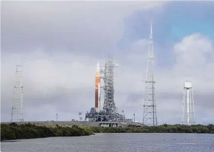  ?? Aubrey Gemignani / Associated Press ?? NASA’s Space Launch System rocket with the Orion spacecraft aboard is seen March 18 on the launch pad before a test.