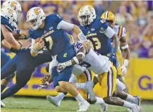  ?? THE ASSOCIATED PRESS ?? UTC quarterbac­k Nick Tiano is sacked on fourth down by LSU safety John Battle during the first half Saturday.