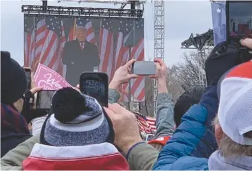  ?? Photo courtesy of Voice of America ?? A crowd watches Donald Trump’s speech at the Ellipse Jan. 6, prior to storming the capitol.