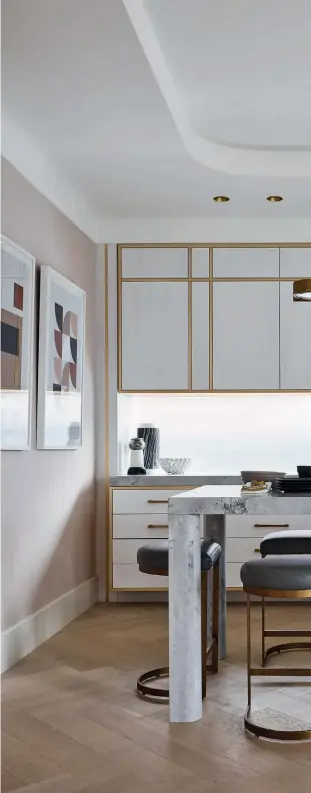  ??  ?? LEFT TO RIGHT
An array of decorative objects adds a quirky touch to the kitchen; this space also features a custom marble island by Greg Natale; the white lacquered American oak shelving and cabinets enhance the light-filled nature of the kitchen; a bespoke full-height oak cabinet keeps parapherna­lia out of sight