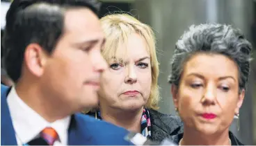  ?? PHOTO: GETTY IMAGES ?? Contenders . . . MP Judith Collins and deputy leader Paula Bennett look on as leader Simon Bridges speaks to media after a caucus meeting in October following the leaking of Bridges’ expenses.