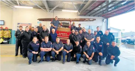  ?? Photo/ Supplied ?? The Ha¯ wera Volunteer Fire Brigade with the fully restored Dennis fire truck.