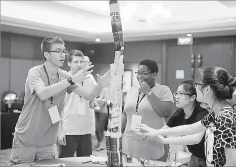  ?? PROVIDED TO CHINA DAILY ?? High school students from China and the United States take part in the Global Connection Program hosted by JA China in Shanghai.