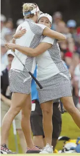  ?? AP PHOTO ?? TEAM EFFORT: Cristie Kerr (right) gets a hug from partner Lexi Thompson after their foursomes victory yesterday at the Solheim Cup in West Des Moines, Iowa. The Americans lead, 101⁄2-51⁄2.