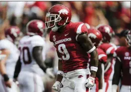  ?? NWA Democrat-Gazette/CHARLIE KAIJO ?? Arkansas defensive back Santos Ramirez reacts after causing and recovering a fumble by Alabama running back Najee Harris during Saturday’s game. The turnover was overturned after being reviewed by the SEC replay command center in Birmingham, Ala. “He let it go, and I fell right on it,” Ramirez said. “But you know how things go sometimes, especially when you’re playing Alabama.”