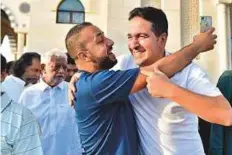  ?? Clint Egbert/Gulf News ?? People meet and greet each other after the early morning prayer at Al Farooq Omar Bin Al Khattab Mosque in Dubai.