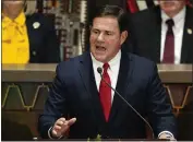  ?? ?? Arizona Republican Gov. Doug Ducey on Thursday signed a massive expansion of the state's private school voucher system. Critics have promised to block the bill.