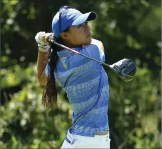  ?? CHARLES REX ARBOGAST, THE ASSOCIATED PRESS ?? Danielle Kang watches her tee shot on the fifth hole during the final round of the Women’s PGA Championsh­ip golf tournament in Olympia Fields, Ill., on Sunday. Kang edged defending champion Brooke Henderson, from Smiths Falls, Ont.