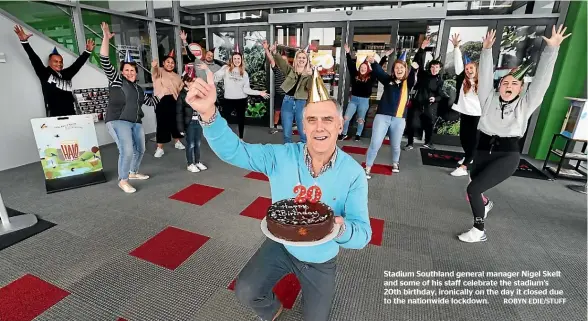  ??  ?? Stadium Southland general manager Nigel Skelt and some of his staff celebrate the stadium’s 20th birthday, ironically on the day it closed due to the nationwide lockdown. ROBYN EDIE/STUFF