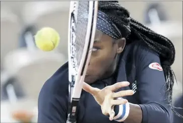  ?? Alessandra Tarantino Associated Press ?? COCO GAUFF of the U. S. plays against Britain’s Johanna Konta in a f irst- round match of the French Open at the Roland Garros stadium in Paris. It was Gauff ’s fourth win against a top- 20 opponent.