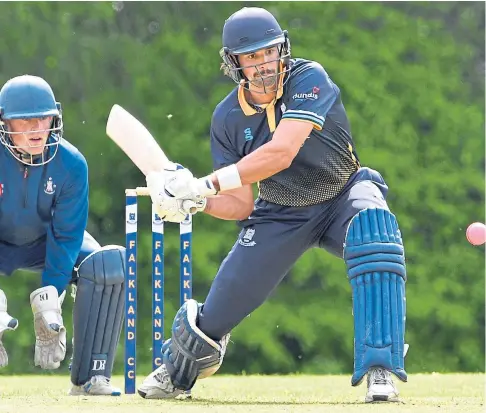  ?? ?? EYES ON THE BALL: Young Australian Charles Cassell hits out during Falkland’s home defeat to Forfarshir­e.