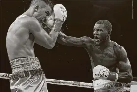  ?? Showtime ?? Houston native Joseph George lands a right hand in his surprise victory over Marcos Escudero on Nov. 15. George won the fight in a split decision.