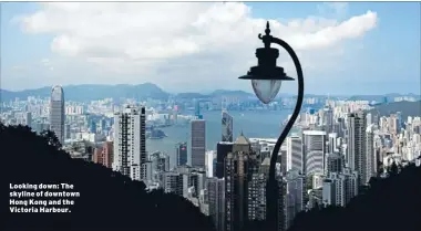  ??  ?? Looking down: The skyline of downtown Hong Kong and the Victoria Harbour.