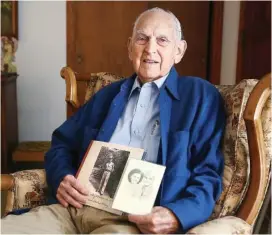  ?? STAFF FILE PHOTO ?? Hoyt Williams Sr. poses for a portrait while holding a photo of himself and a photo of his wife and himself in 2017 at his home in Trion, Ga.