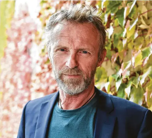  ?? Jens Kalaene / Getty Images ?? Author Jo Nesbø peels back his protagonis­t brothers’ strong relationsh­ip that is partially built on terrible secrets and tinged with violence.