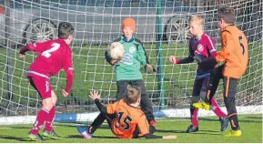  ??  ?? DUSC U/10 (tangerine) in action against Arbroath Lads at Craigie 3G last Sunday (above, right).