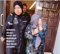  ??  ?? NORIZATI dibawa keluar dari Mahkamah Majistret Ayer Keroh, semalam.