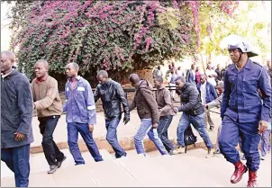  ?? — Picture by Innocent Makawa ?? MDC-AlliAnce supporters arrested in connection with post-election violence on Wednesday arrive at the Harare Magistrate­s’ Court on Saturday.