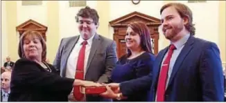  ??  ?? Attorney Margaret J. Amoroso of Middletown is sworn in Monday afternoon as a judge in the Delaware County Court of Common Pleas. With her are her children, from left, Alex, Laura and Michael.