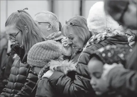  ?? [BARBARA J. PERENIC/DISPATCH PHOTOS] ?? A prayer vigil for fallen Westervill­e Police Officer Eric Joering, 39, was held Monday night at the Central Ohio Joint Fire District station in Centerburg. The Joering family lives just outside Centerburg.