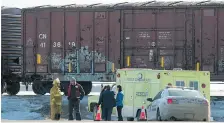  ?? LIAM RICHARDS/The StarPhoeni­x ?? RCMP and the Radisson Fire Department maintain the scene where an 11-year-old was killed after being struck by a train near Radisson Saturday.