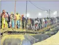  ??  ?? Hindu devotees arrive to take a holy bath at the Sangam, the confluence of the rivers Ganges, Yamuna and mythical Saraswati.