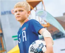  ??  ?? Soccer fan and player Cole Creasy, 8, of Bethlehem waits for the start of the game.