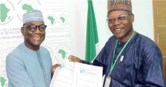  ?? ?? L-R: Director General, African Developmen­t Bank Group, Mr. Lamin Barrow and Executive Secretary, Hadejia Jama’are Komadugu Yobe Trust Fund, Dr. Hassan Bdliya during the official signing of the EUR 362,000 grant for Preparatio­n of a Strategic Action Plan for Water Resources Developmen­t for Komadugu-Yobe Basin Phase II, in Abuja on March 8, 2023.