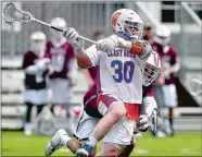  ?? TIM MARTIN/THE DAY ?? Coast Guard’s Will Iorio (30) fires a shot on goal during the first half of the NEWMAC men’s lacrosse tournament final against Springfiel­d on Saturday at New London. Springfiel­d won 11-7.