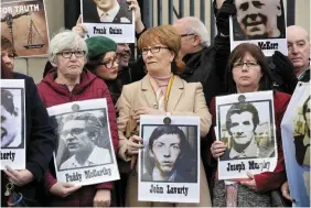  ??  ?? Truth: Relatives of those who died in the Ballymurph­y shootings outside the inquest in Belfast, and (right) Michael Mansfield QC