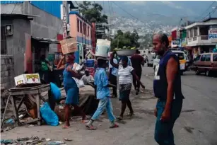  ?? (The Washington Post) ?? Port - au - Prince on the day of the dead president’s funeral