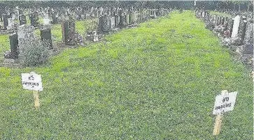  ??  ?? Pictured are the ‘no parking’ signs that Katrina Glenn has put up in Loughborou­gh cemetery after fearing that drivers might park on her sisters grave.