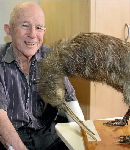  ??  ?? Chalmers Home resident Owen Henry with Okoki the kiwi.