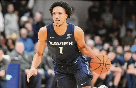  ?? Mitchell Leff/Getty Images ?? New Haven native Demond Claude is averaging 16 points, 4.8 rebounds and 4 assists per game for the Musketeers.