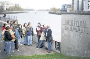  ?? REUTERS ?? US students attend a guided tour with Pierre Guillon de Prince and Dieudonne Boutrin at the Memorial to the Abolition of Slavery in Nantes, France, on March 23.