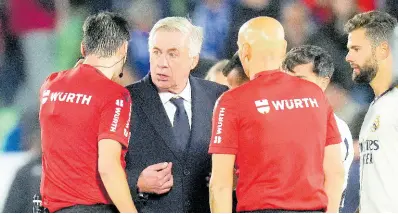  ?? AP ?? Real Madrid’s head coach Carlo Ancelotti talks to the referees after the Spanish La Liga match between Getafe and Real Madrid at the Coliseum Alfonso Perez stadium in Getafe, Spain.