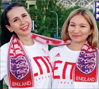  ??  ?? GOOD AMBASSADOR­S: Natasha Grebyenkin­a, left, and friend Anna Akmuradova get ready to cheer for England