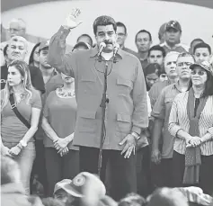 ??  ?? Maduro delivers a speech to supporters in Caracas. — AFP photo