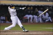  ?? DARREN YAMASHITA — THE ASSOCIATED PRESS ?? The Oakland Athletics’ Sheldon Neuse breaks his bat on a swing against the Texas Rangers during the sixth inning Thursday in Oakland.