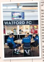  ??  ?? In it together: The Watford players mingle during breakfast at the training ground and (below) Etienne Capoue