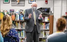  ?? ALYSSA POINTER/ALYSSA.POINTER@AJC.COM ?? Gwinnett County Public Schools Superinten­dent and CEO J. Alvin Wilbanks speaks with Burnette Elementary School parents and staff last month. The Gwinnett school board voted to end his long tenure a year early, buying out his contract.