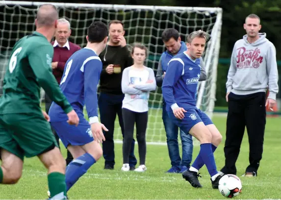  ??  ?? Adam Moynihan, Killarney Athletic, passes the ball to Jamie Doona against Doolan’s Cow FC Cork in the Champions League at Woodlawn, Killarney on Sunday