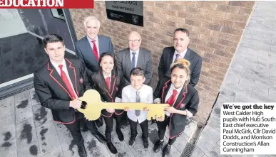  ??  ?? We’ve got the key West Calder High pupils with Hub South East chief executive Paul McGirk, Cllr David Dodds, and Morrison Constructi­on’s Allan Cunningham