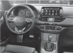  ?? HYUNDAI ?? A heated steering wheel, Apple CarPlay and Android Auto are among the standard features in the new Hyundai Elantra GT.