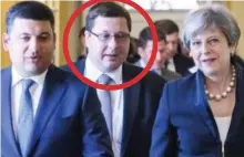  ??  ?? Talks: Mr Yezhov, circled, with his boss and Mrs May