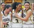  ?? CATHERINE AVALONE — REGISTER ?? Form left, Hand’s Sara Wohlgemuth Gabby Martin and Gabby Egidio celebrate their Class L semifinal win over Pomperaug Saturday.