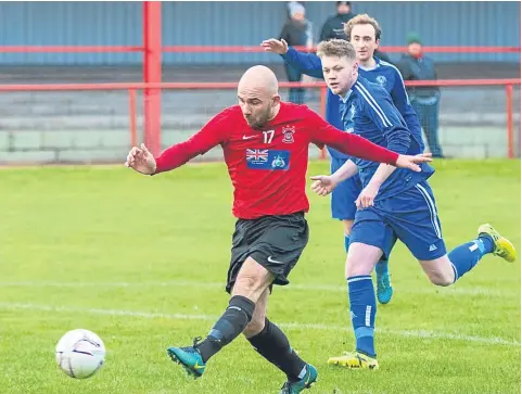  ??  ?? Alan Tulleth fires Tayport ahead against Kirrie Thistle at The Canniepair­t. The Fifers won the Premier League clash 3-2.